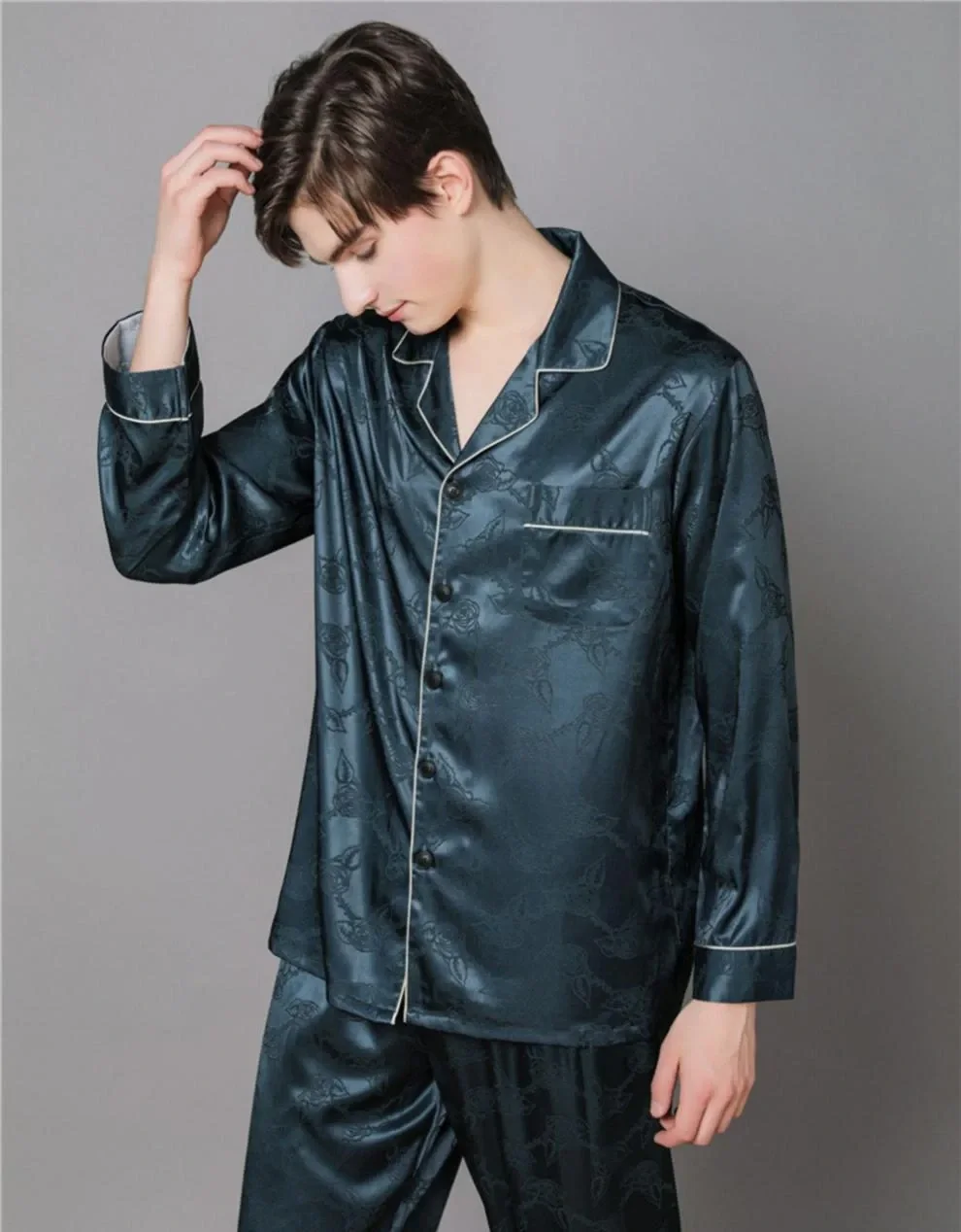 Man wearing the navy rose-jacquard pajama set