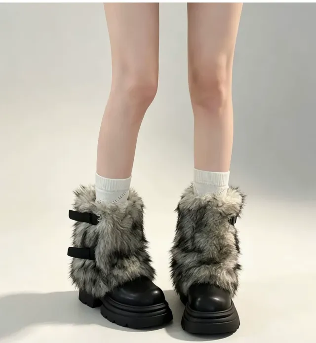Black fluffy buckle platform boots with gray-tipped plush, worn with white socks