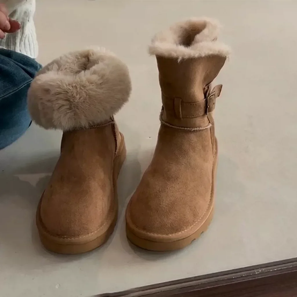 Chestnut fold-over boots, one cuff folded down and one worn up with the buckle